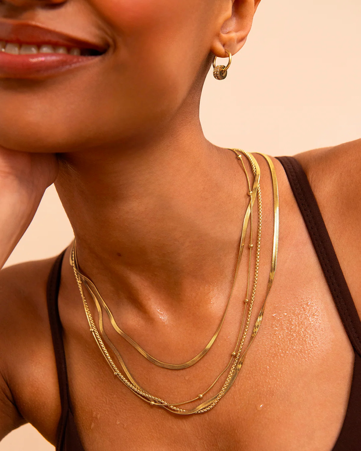 Charm Seamless Huggie Earrings in Gold - Image 2