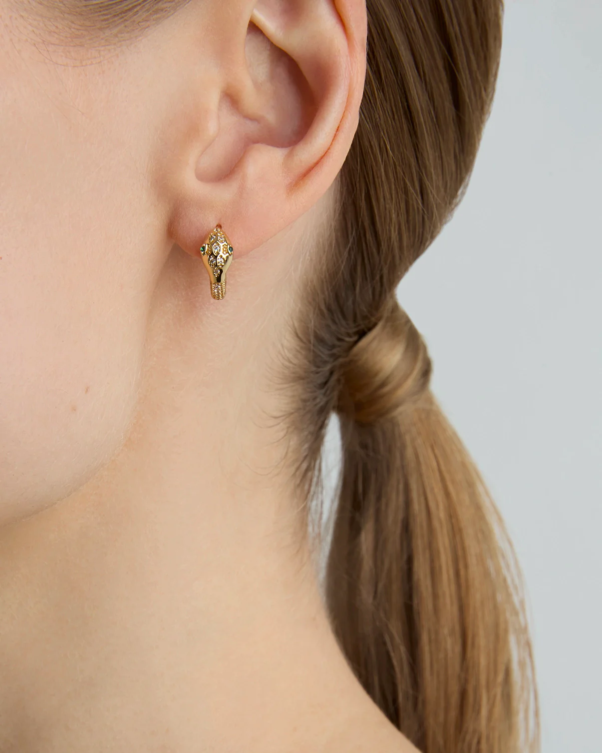 Snake Huggie Earrings in Gold - Image 2