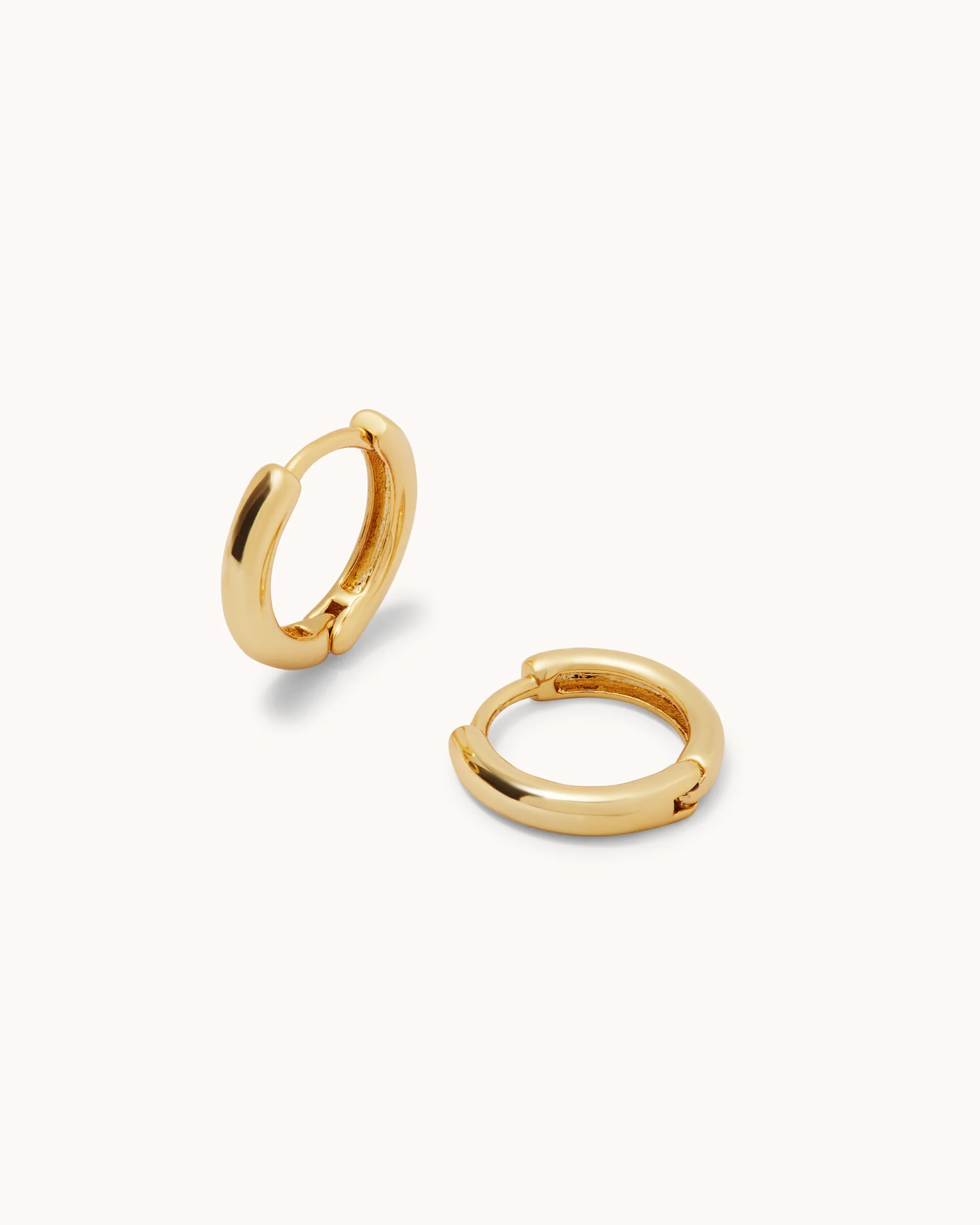 Mini Seamless Huggie Hoop Earrings in Gold - Image 2