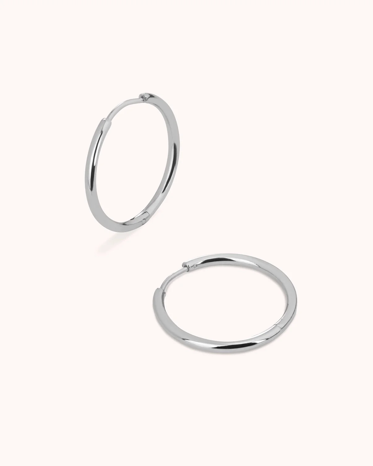 Thin Round Seamless Huggie Hoop Earrings in Silver - Image 3