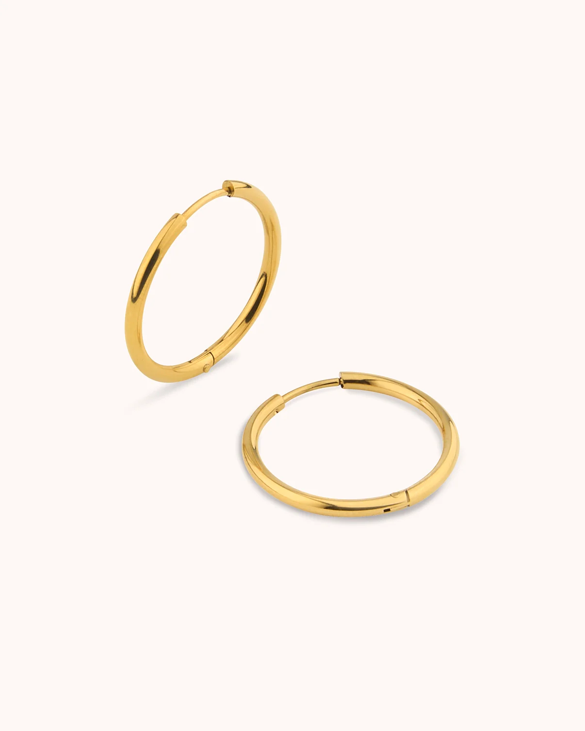 Waterproof Round Seamless Huggie Hoop Earrings in Gold - Image 3