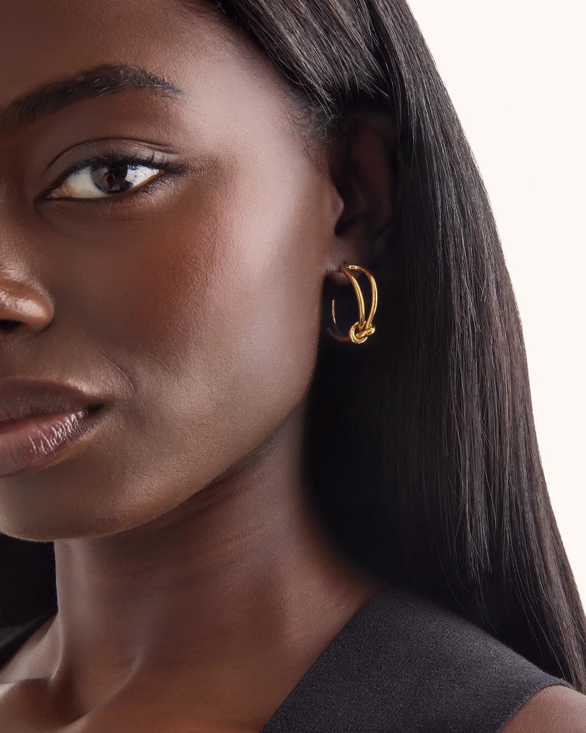 Waterproof Double Layered Knot Hoop Earrings in Gold - Image 2