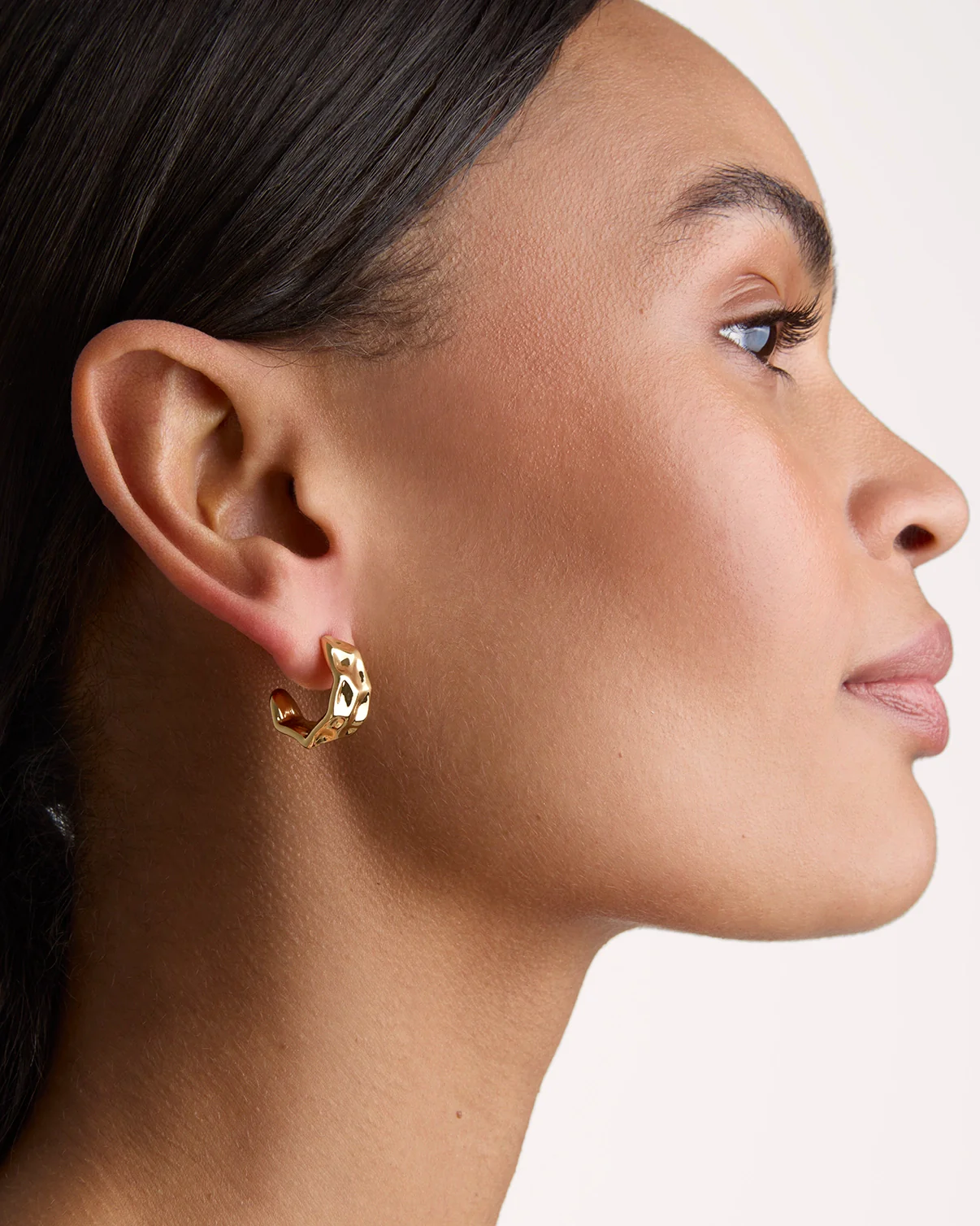 Tiny Molten Hoop Earrings in Gold - Image 2